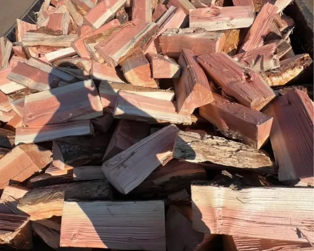 Firewood in Cedar BC: freshly split fir firewood piled in a truck bin
